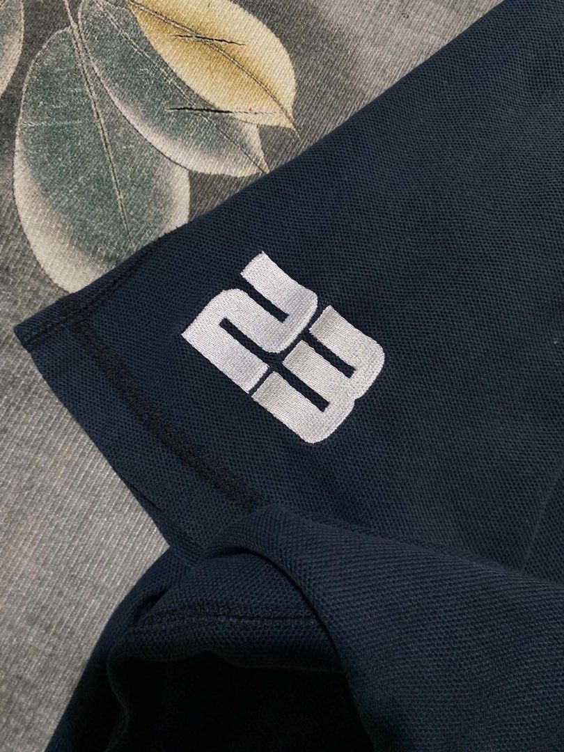 Jordan Polo (Category: Tshirts & Polo Shirts ) located in Caloocan City. Submitted by kardoyredb54515 (Listing ID 1459708514, Image 3). Description: - Navy blue Jordan polo shirt - Features embroidered Jordan logo on the sleeve - Small Jordan tag detail on the cuff - Classic polo collar design - Ideal for casual everyday wear.