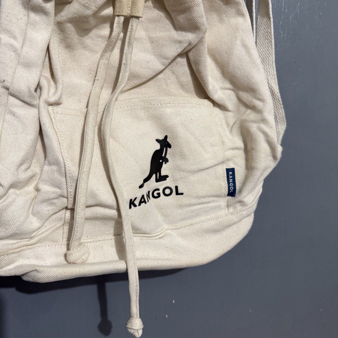 Kangol Canvas Drawstring Backpack Bag Cream (Category: Backpacks) located in Manila. Submitted by preciousma24494 (Listing ID 1459814013, Image 2). Description: - Brand: Kangol - Color: Cream - Material: Canvas - Style: Drawstring backpack - Features: Front pocket, zippered inner pocket, adjustable straps - Ideal for: Everyday use, minimalist aesthetic.