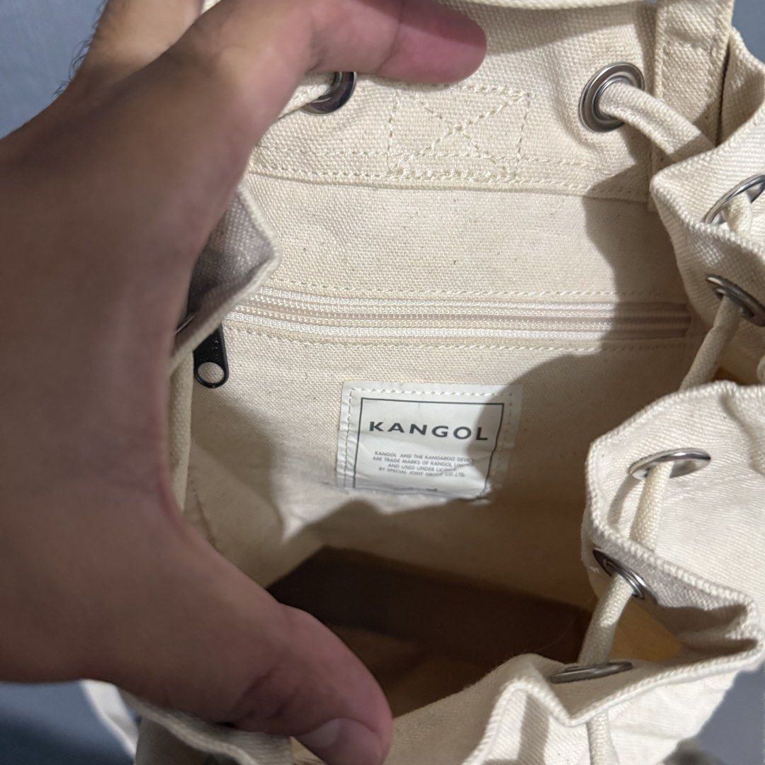 Kangol Canvas Drawstring Backpack Bag Cream (Category: Backpacks) located in Manila. Submitted by preciousma24494 (Listing ID 1459814013, Image 3). Description: - Brand: Kangol - Color: Cream - Material: Canvas - Style: Drawstring backpack - Features: Front pocket, zippered inner pocket, adjustable straps - Ideal for: Everyday use, minimalist aesthetic.
