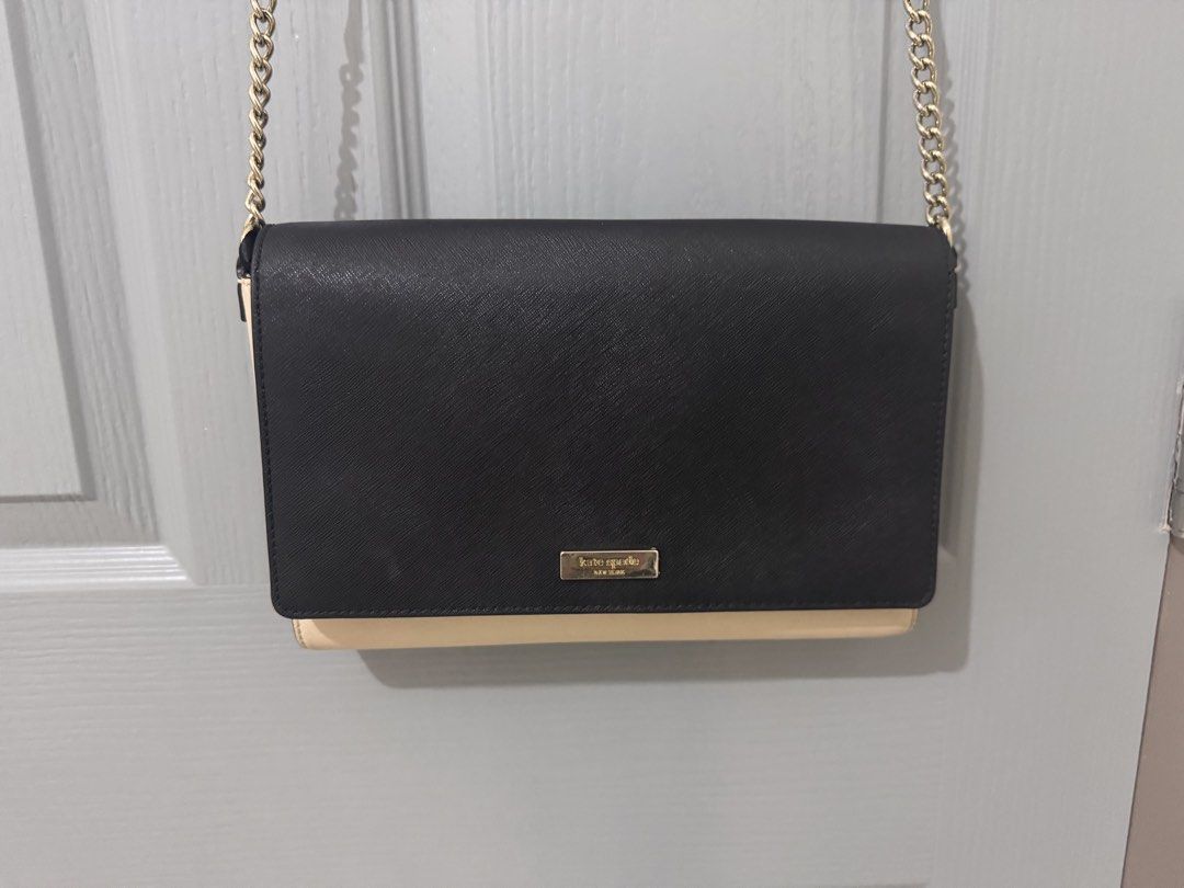Kate Spade Black Beige Chain Sling Bag (Category: Luxury Bags & Wallets) located in Caloocan City. Submitted by luxxethriftfinds (Listing ID 1459802005, Image 1). Description: - Authentic Kate Spade New York shoulder bag - Stylish black and beige color block design - Elegant gold chain strap - Interior includes a zip pocket and card slots - Bag interior is clean - Versatile for both everyday use and evening events.