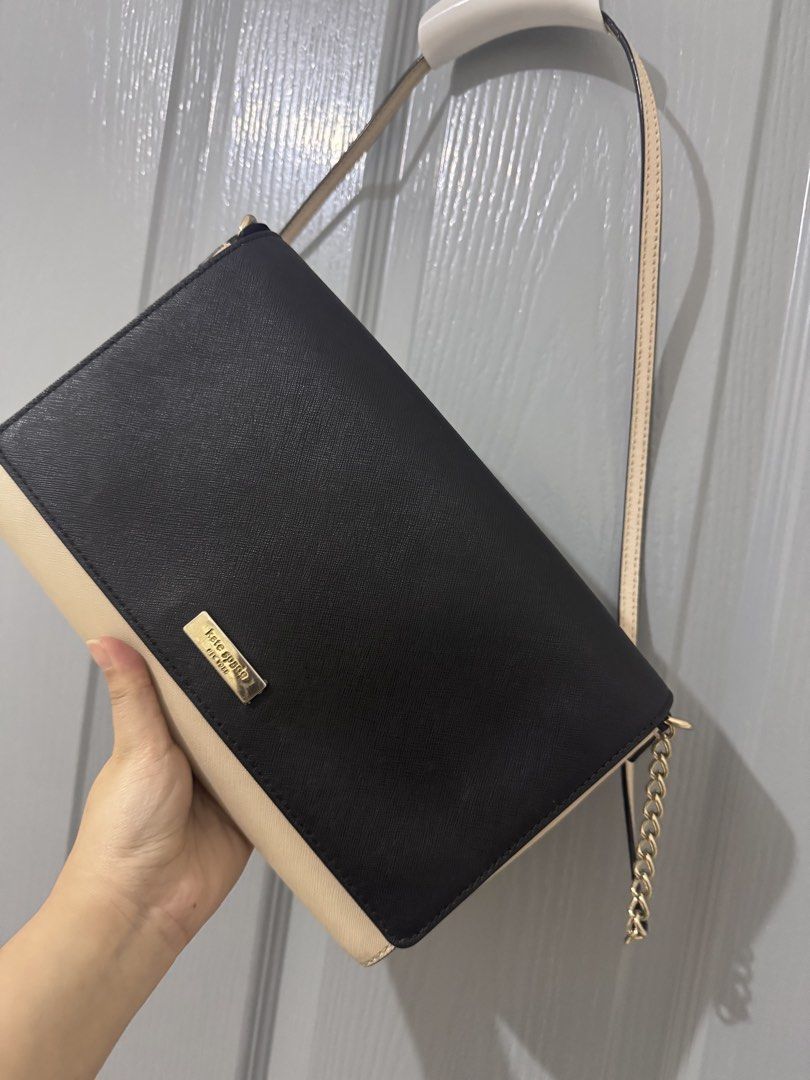 Kate Spade Black Beige Chain Sling Bag (Category: Luxury Bags & Wallets) located in Caloocan City. Submitted by luxxethriftfinds (Listing ID 1459802005, Image 2). Description: - Authentic Kate Spade New York shoulder bag - Stylish black and beige color block design - Elegant gold chain strap - Interior includes a zip pocket and card slots - Bag interior is clean - Versatile for both everyday use and evening events.