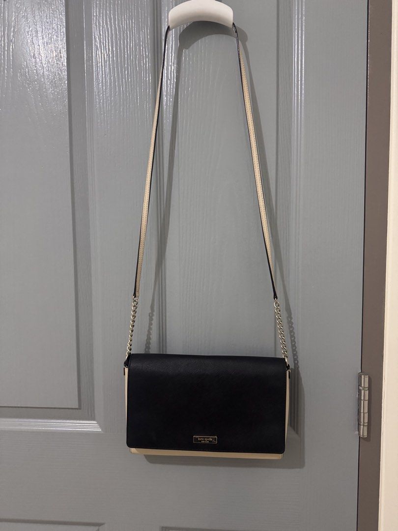 Kate Spade Black Beige Chain Sling Bag (Category: Luxury Bags & Wallets) located in Caloocan City. Submitted by luxxethriftfinds (Listing ID 1459802005, Image 3). Description: - Authentic Kate Spade New York shoulder bag - Stylish black and beige color block design - Elegant gold chain strap - Interior includes a zip pocket and card slots - Bag interior is clean - Versatile for both everyday use and evening events.
