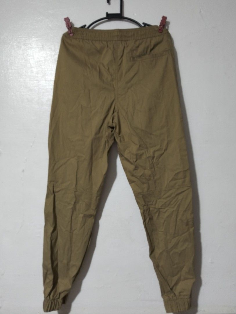 Khaki Jogger Pants with Drawstring and Zip Pockets (Category: Other Bottoms) located in Manila. Submitted by oddhorse_8ada97 (Listing ID 1459752872, Image 3). Description: - Khaki jogger pants - Elastic waistband with drawstring - Two front zip pockets - One back pocket - Cuffed ankles - Comfortable fit, perfect for casual wear.