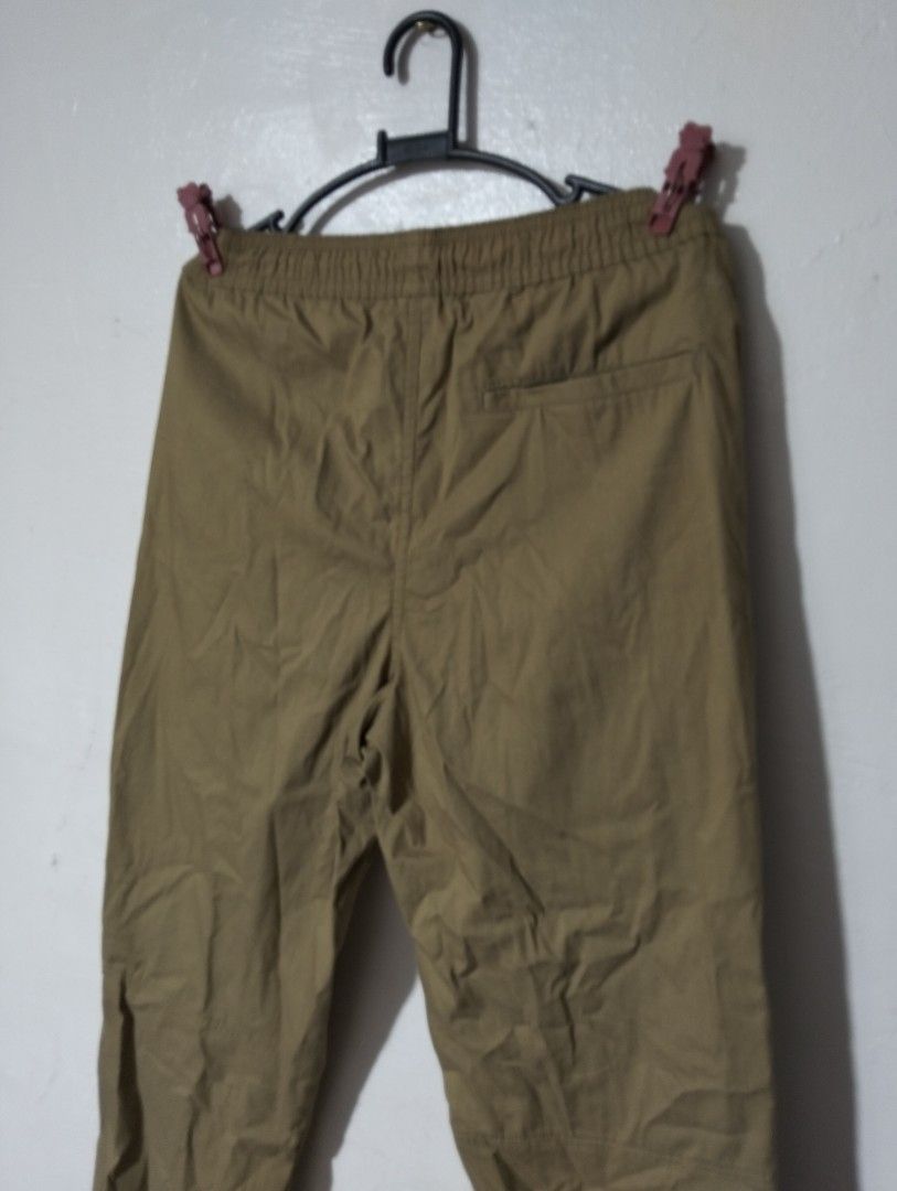 Khaki Jogger Pants with Drawstring and Zip Pockets (Category: Other Bottoms) located in Manila. Submitted by oddhorse_8ada97 (Listing ID 1459752872, Image 1). Description: - Khaki jogger pants - Elastic waistband with drawstring - Two front zip pockets - One back pocket - Cuffed ankles - Comfortable fit, perfect for casual wear.