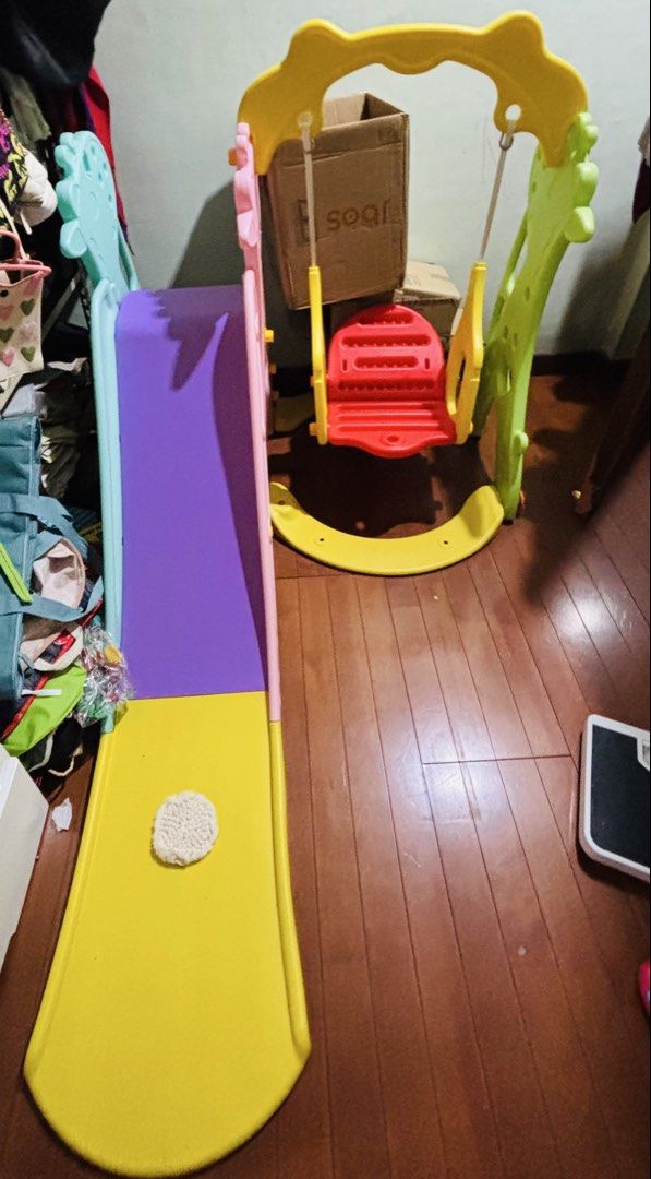 Kids Slide and Swing Set with Giraffe Design (Category: Kids Toys) located in Paranaque City. Submitted by bleshy (Listing ID 1459783648, Image 2). Description: - Fun indoor playground for toddlers and young children. - Features a slide and a swing with a cute giraffe design. - Bright and cheerful colors to liven up playtime. - Made from sturdy plastic for durability. - Easy to assemble for quick setup. - Provides hours of entertainment and activ