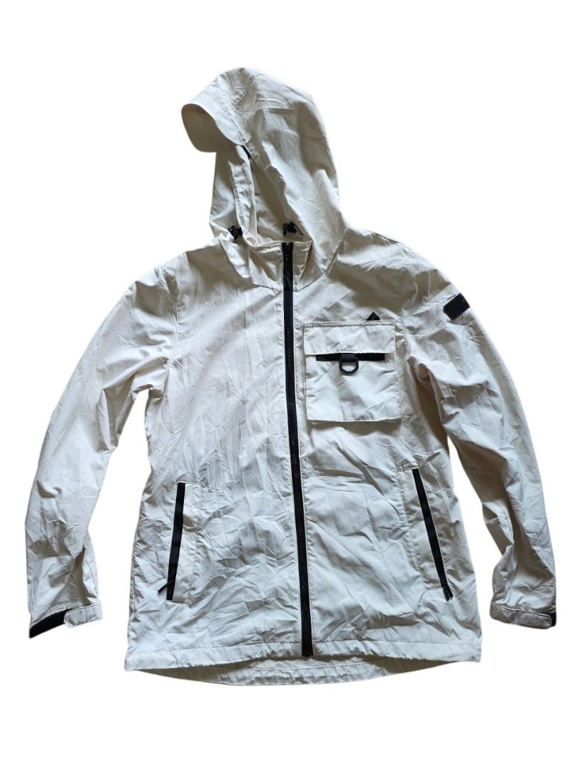 Kovea rainjacket (Category: Coats, Jackets and Outerwear) located in Manila. Submitted by captaindav11912 (Listing ID 1459703462, Image 2). Description: - Lightweight hooded jacket from Kovea - Beige color with black zippers and accents - Chest pocket with unique buckle detail - Convenient side pockets - Adjustable drawstring inside the waist for a custom fit - Ideal for outdoor adventures or everyday casual style - Packable and easy to carry -As