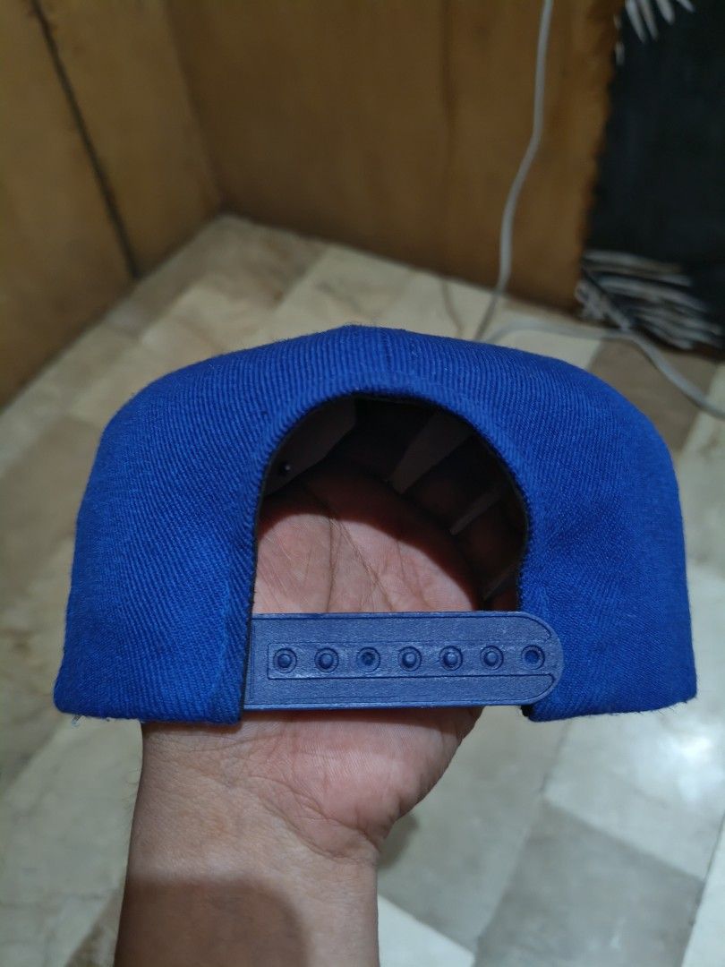 LA Dodgers Snapback Cap Blue Black (Category: Caps & Hats) located in Tagum. Submitted by Villanuevarex2795 (Listing ID 1459789368, Image 3). Description: - Classic LA Dodgers snapback hat - Iconic embroidered LA logo on front - Blue crown with black brim - Green underside of brim - Adjustable snap closure for a custom fit - Ideal for Dodgers fans and streetwear enthusiasts.