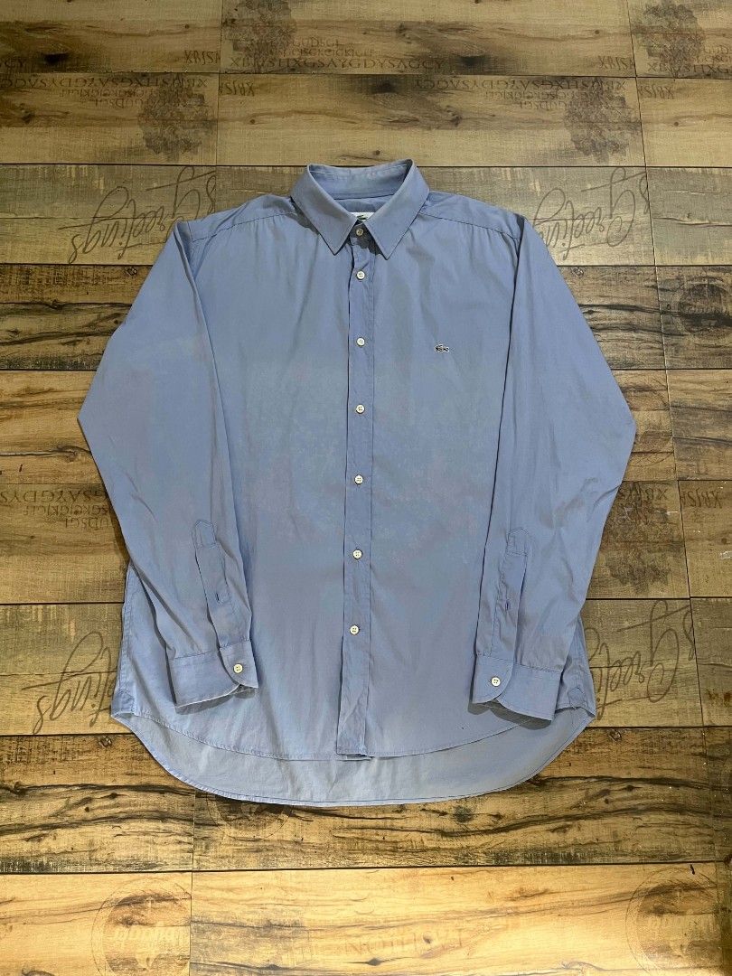Lacoste blue long-sleeve button-down (authentic) (Category: Formal Shirts) located in Mahaplag. Submitted by thriftnimarz (Listing ID 1459720871, Image 1). Description: Good/excellent condi Issue nasa last 2 pic sign of usage Color Dimes- 23.5/28.5 Cr- 9/10.