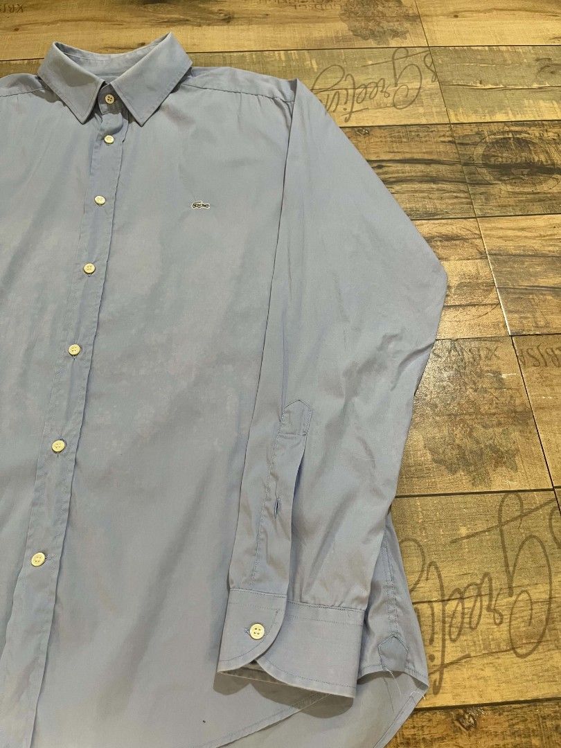 Lacoste blue long-sleeve button-down (authentic) (Category: Formal Shirts) located in Mahaplag. Submitted by thriftnimarz (Listing ID 1459720871, Image 3). Description: Good/excellent condi Issue nasa last 2 pic sign of usage Color Dimes- 23.5/28.5 Cr- 9/10.