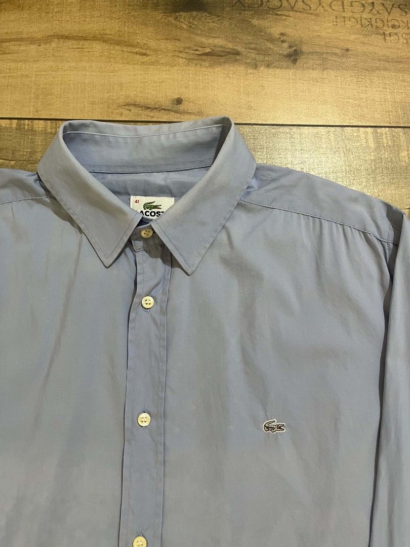 Lacoste blue long-sleeve button-down (authentic) (Category: Formal Shirts) located in Mahaplag. Submitted by thriftnimarz (Listing ID 1459720871, Image 2). Description: Good/excellent condi Issue nasa last 2 pic sign of usage Color Dimes- 23.5/28.5 Cr- 9/10.