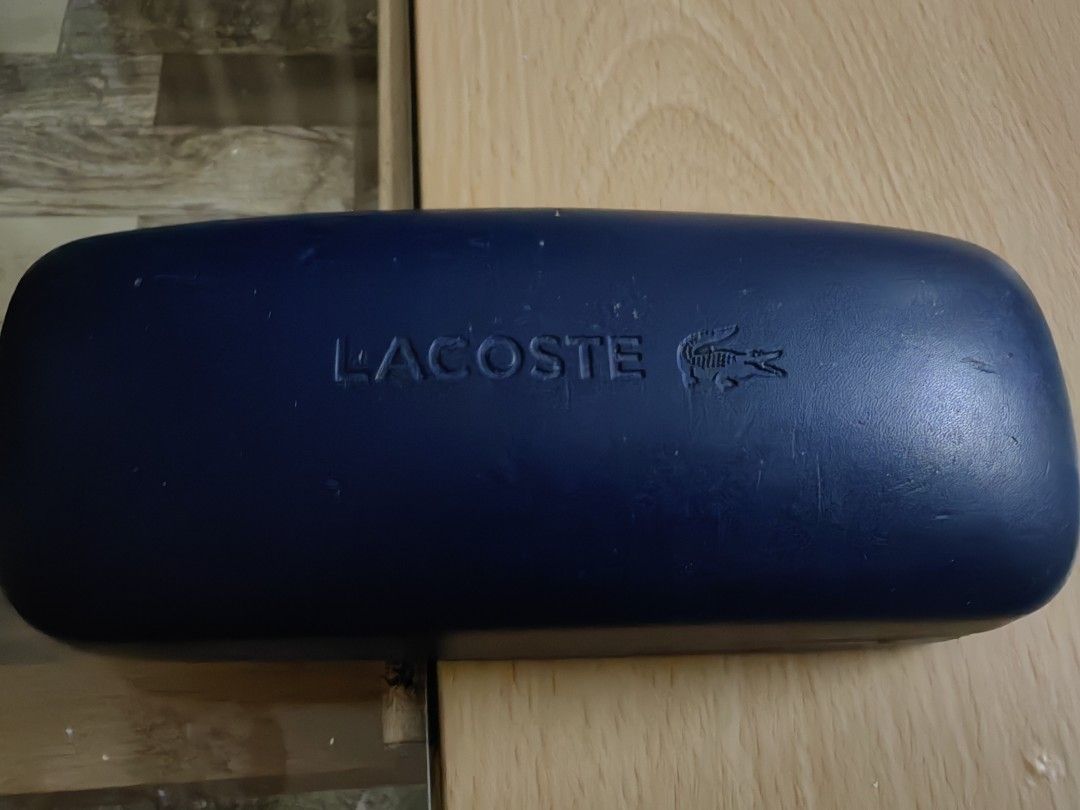 Lacoste Eyeglasses with Case (Category: Sunglasses & Eyewear) located in Cavite. Submitted by klosetnijuan (Listing ID 1459796256, Image 3). Description: Brown tortoise shell eyeglasses from Lacoste. Comes with the original hard case. The case has the Lacoste logo embossed on top. Inside the case, there's a quote about playing and winning with elegance. The glasses have thin metal arms. Great for everyday wear. Original price was 8k.