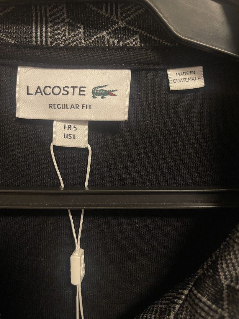 Lacoste jacket (Category: Coats, Jackets and Outerwear) located in Manila. Submitted by alldayshoppinggirl (Listing ID 1459704631, Image 3). Description: 💯 Original Store bought Negotiable Lacoste Paris Jacquard Monogram Zipped Sweatshirt in black and graphite, featuring an all-over geometric monogram pattern and contrasting stripe detailing along the sleeves. The target body measurements and exact dimensions for this jacket in a Size 5 (Large) 