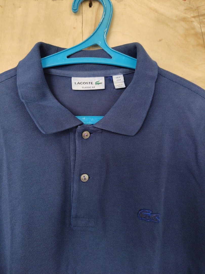 Lacoste polo shirt (Category: Tshirts & Polo Shirts ) located in La Carlota. Submitted by a_leam_art (Listing ID 1459764151, Image 2). Description: Embroid patch logo 📍Dimes: W19 x L26 📍Condition: Good 📍Issue: Multiple pin holes 📍Color rate: 10/10 (re-dyed).