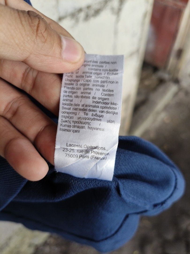 Lacoste polo shirt (Category: Tshirts & Polo Shirts ) located in La Carlota. Submitted by a_leam_art (Listing ID 1459764151, Image 3). Description: Embroid patch logo 📍Dimes: W19 x L26 📍Condition: Good 📍Issue: Multiple pin holes 📍Color rate: 10/10 (re-dyed).