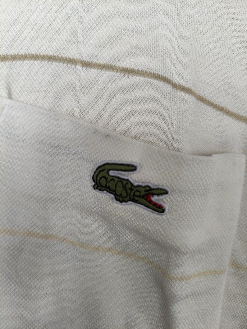 Lacoste polo shirt (Category: Tshirts & Polo Shirts ) located in La Carlota. Submitted by a_leam_art (Listing ID 1459776975, Image 3). Description: Embroidered logo 📍Dimes: W21 x L25 📍Condition: Good 📍Issue: --- 📍Color rate: 9/10.