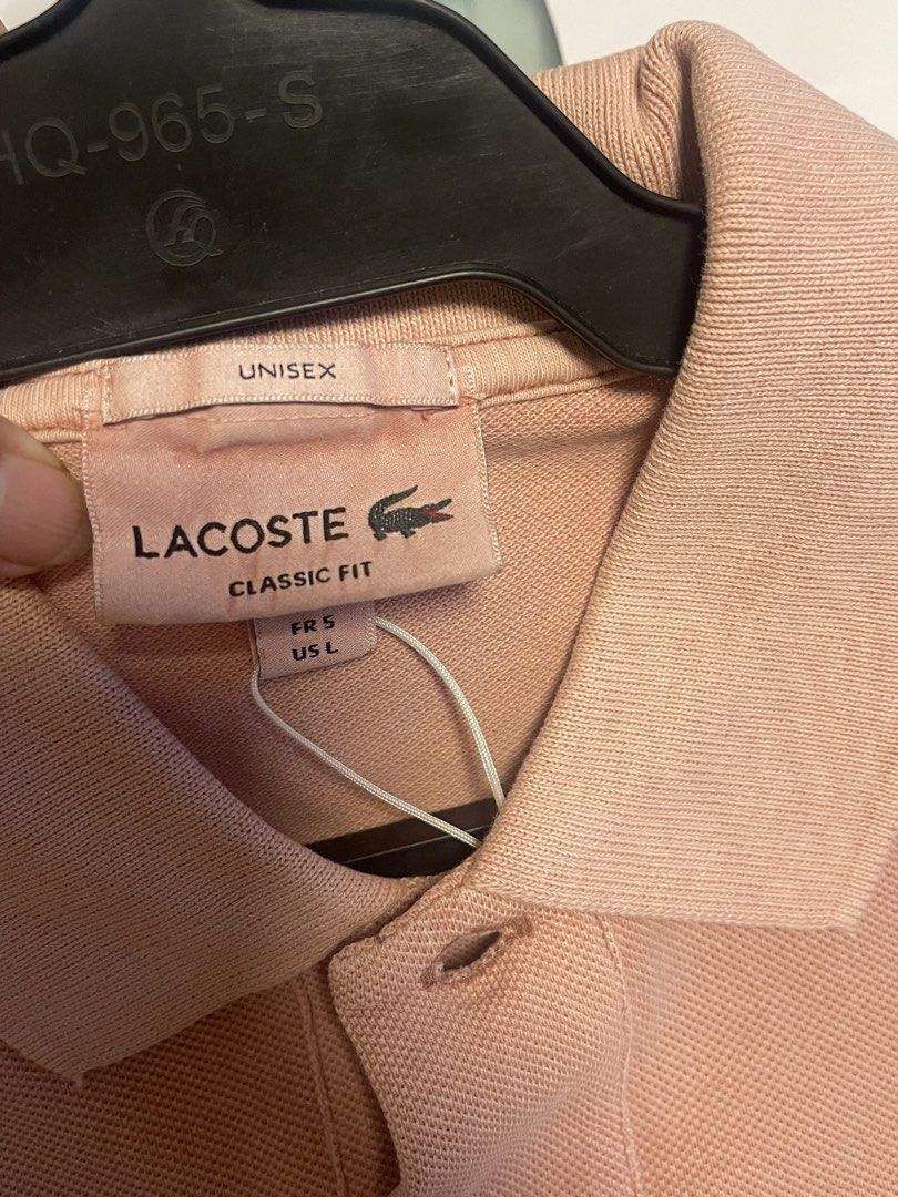 Lacoste Poloshirt (Category: Coats, Jackets and Outerwear) located in Manila. Submitted by alldayshoppinggirl (Listing ID 1459706657, Image 3). Description: 💯 Original Store bought Negotiable Pink Lacoste cotton piqué polo shirt featuring a matching tonal embroidered crocodile logo on the chest. CLASSIC FIT model (comfortable straight-cut ) Dimension: * Width (Pit-to-Pit): 22.5 inches (57cm) * Chest Circumference: 41” – 43” (105cm – 109cm) * Len