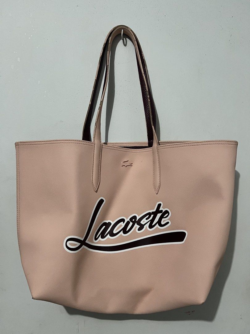 Lacoste Reversible Tote Bag (Category: Tote Bags) located in Quezon City. Submitted by charlenedv58782 (Listing ID 1459732126, Image 1). Description: 💕 Reversible Lacoste tote bag — 2 colours in 1! One side: blush pink | Other side: burgundy 🤎💗 ✨ Original Lacoste ✨ Spacious and perfect for everyday use ✨ Can be styled with either side ⚠️ Pre-loved: has visible wear on the handles/edges, as shown in the photos. Still very usable. With dustbag B