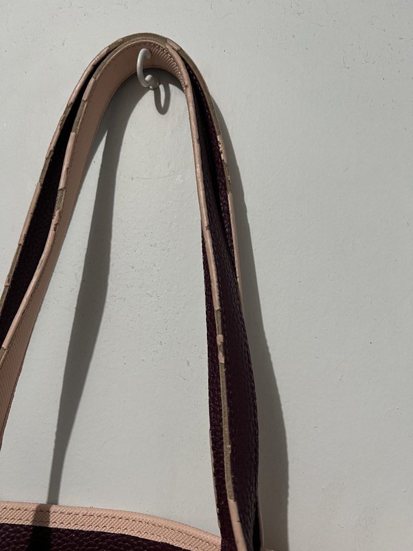 Lacoste Reversible Tote Bag (Category: Tote Bags) located in Quezon City. Submitted by charlenedv58782 (Listing ID 1459732126, Image 3). Description: 💕 Reversible Lacoste tote bag — 2 colours in 1! One side: blush pink | Other side: burgundy 🤎💗 ✨ Original Lacoste ✨ Spacious and perfect for everyday use ✨ Can be styled with either side ⚠️ Pre-loved: has visible wear on the handles/edges, as shown in the photos. Still very usable. With dustbag B