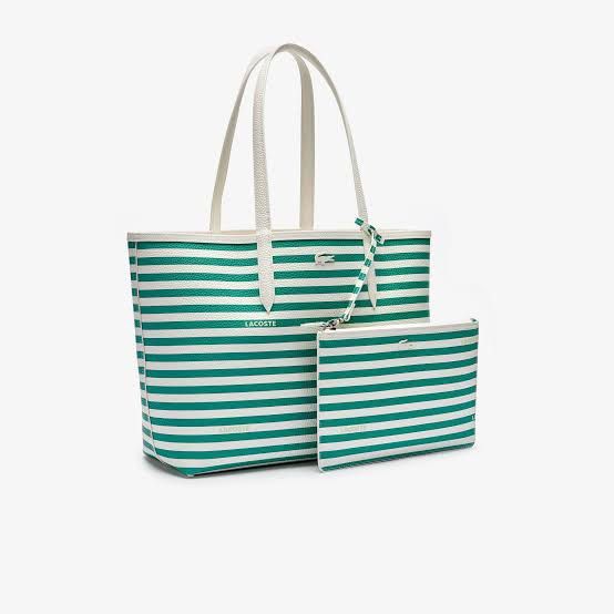 Lacoste Tote Bag with Pouch - Green Stripe (Category: Tote Bags) located in Cavite. Submitted by chamieee_ (Listing ID 1459780314, Image 1). Description: - Authentic Lacoste tote bag - Classic green and white stripes - Includes a matching zippered pouch - Interior also features stripes - White handles - Ideal for everyday errands or travel.