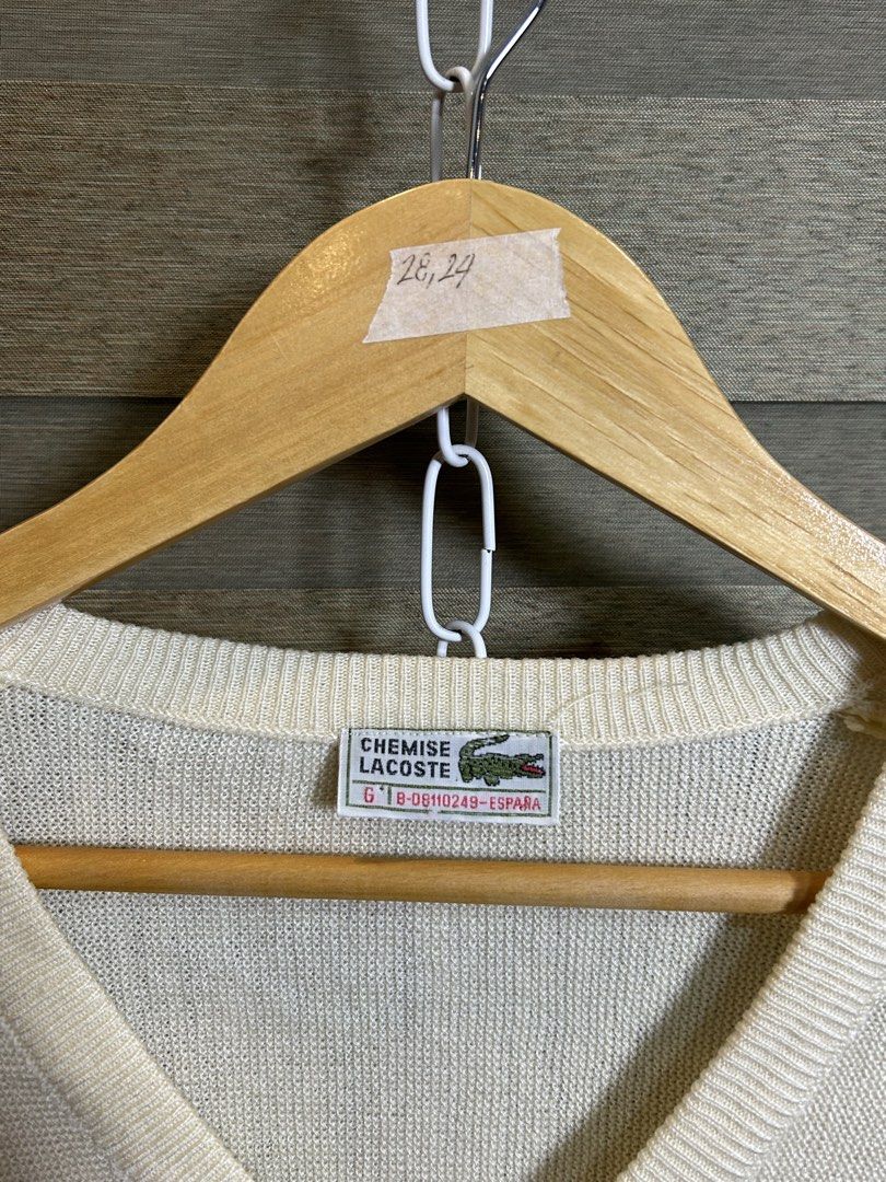 Lacoste V-Neck Sweater Cream (Category: Coats, Jackets and Outerwear) located in Santa Ana. Submitted by thrift.sanctuary (Listing ID 1459732745, Image 3). Description: 28,24 Classic cream v-neck sweater from Lacoste. - Features the signature crocodile logo embroidered on the chest. - Lightweight knit, ideal for layering. - Versatile for casual or smart-casual styling. - Pairs well with jeans or trousers..