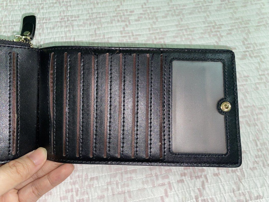 Large Foldable Card Holder Wallet (Category: Wallets & Card holders) located in Angeles City. Submitted by dwnmxn (Listing ID 1459736972, Image 3). Description: - Large foldable card holder wallet - Secure zip-around closure - Large capacity, multiple card slots - Clear ID window - Zippered compartment for coins/small items - Compact and functional for everyday use.
