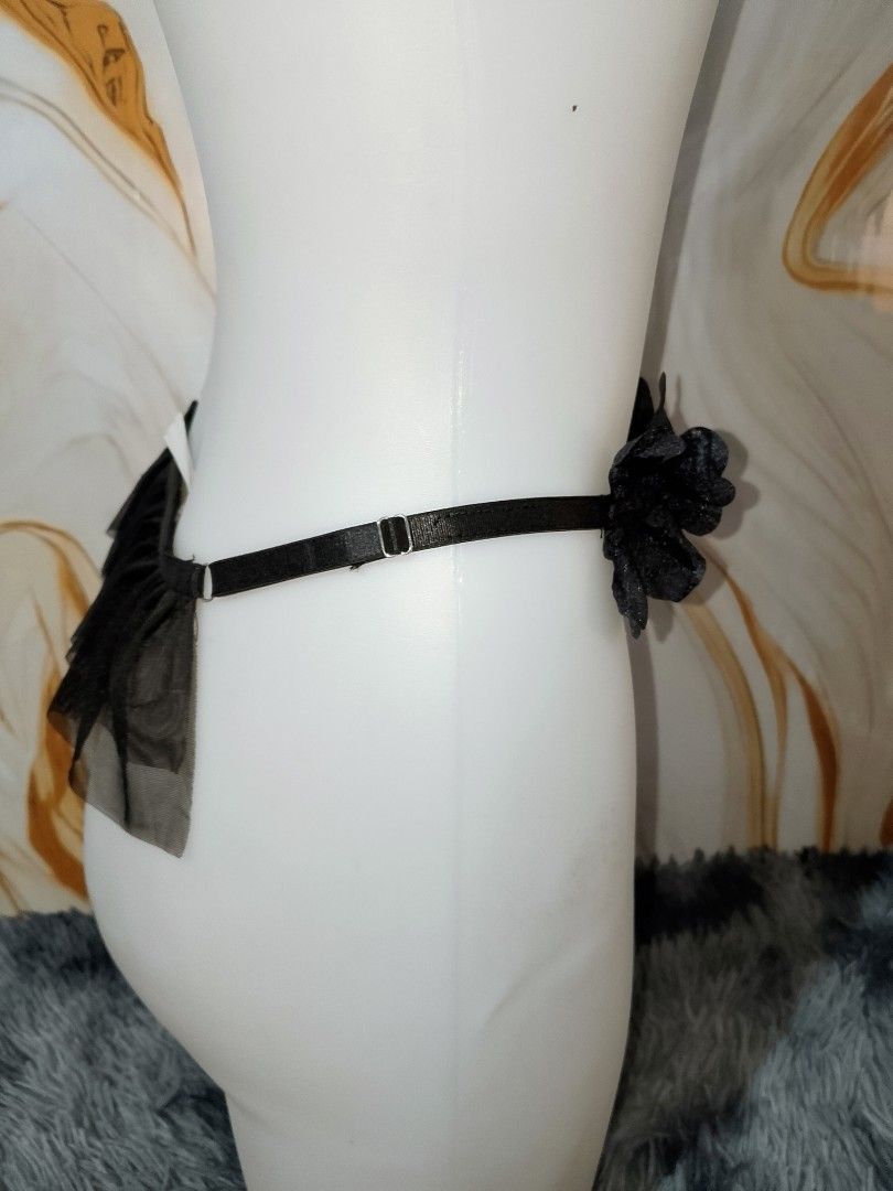 L::Black Mesh G-String with Floral Appliques (Category: Undergarments & Loungewear) located in Manila. Submitted by truecrystal-1407 (Listing ID 1459796921, Image 2). Description: - Sheer black mesh g-string - Delicate floral appliques on waistband - Adjustable straps for a comfortable fit - Ruffled tulle detail on the back - Alluring and delicate design.