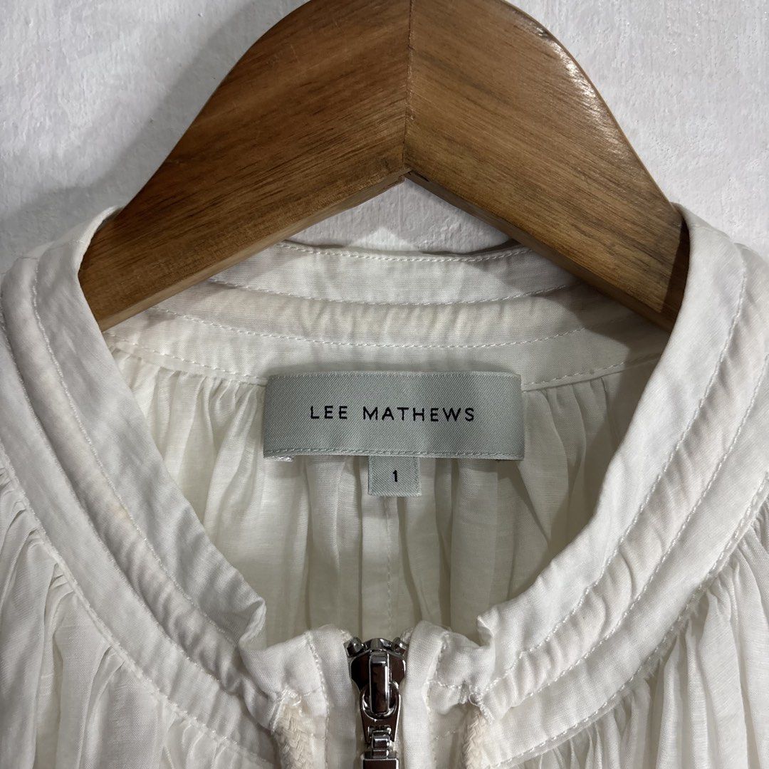 Lee Mathews - White Zip Up Jacket Size 1 (Category: Coats, Jackets and Outerwear) located in Cavite. Submitted by goodstayojan.cvt (Listing ID 1459785839, Image 2). Description: Lee Mathews - Bomber Zipped up Longsleeve 1 on tag(22 x 30 x 20sleeves) Verygood Condition No flaws! Need wash! - White zip-up jacket by Lee Mathews - Made from a Tencel, Nylon, and Linen blend - Features a drawstring hem and neckline for adjustable fit - Lightweight and 