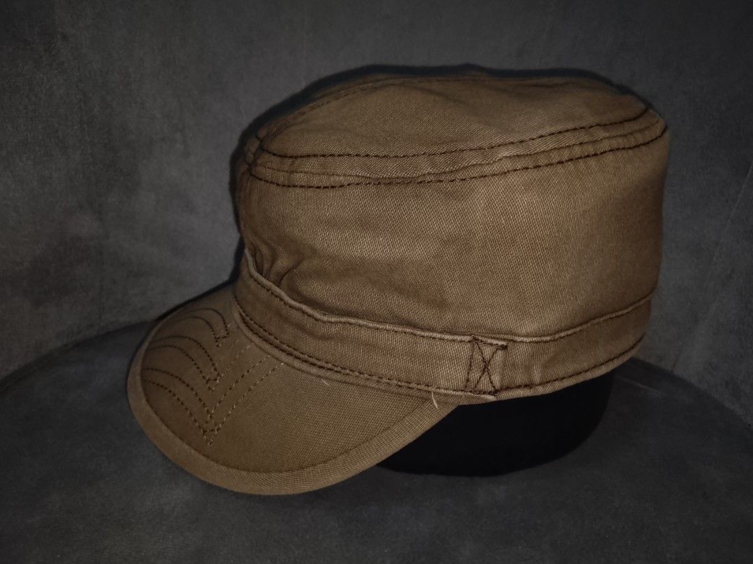 Levi's Cadet/Patrol Cap (Category: Caps & Hats) located in Binangonan. Submitted by yuristalin888 (Listing ID 1459808072, Image 3). Description: Upgrade your casual wardrobe with this rugged, vintage-wash brown Levi’s cadet/military cap. Crafted from durable cotton canvas, it features distinctive contrast topstitching, decorative stitching lines on the brim, and a side accent band secured with a signature Levi Strauss & Co. metal button. * **Bran