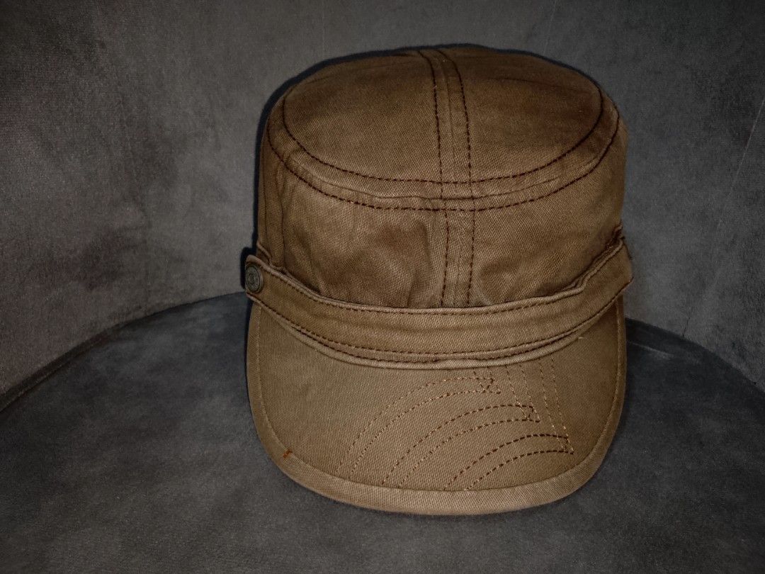 Levi's Cadet/Patrol Cap (Category: Caps & Hats) located in Binangonan. Submitted by yuristalin888 (Listing ID 1459808072, Image 2). Description: Upgrade your casual wardrobe with this rugged, vintage-wash brown Levi’s cadet/military cap. Crafted from durable cotton canvas, it features distinctive contrast topstitching, decorative stitching lines on the brim, and a side accent band secured with a signature Levi Strauss & Co. metal button. * **Bran