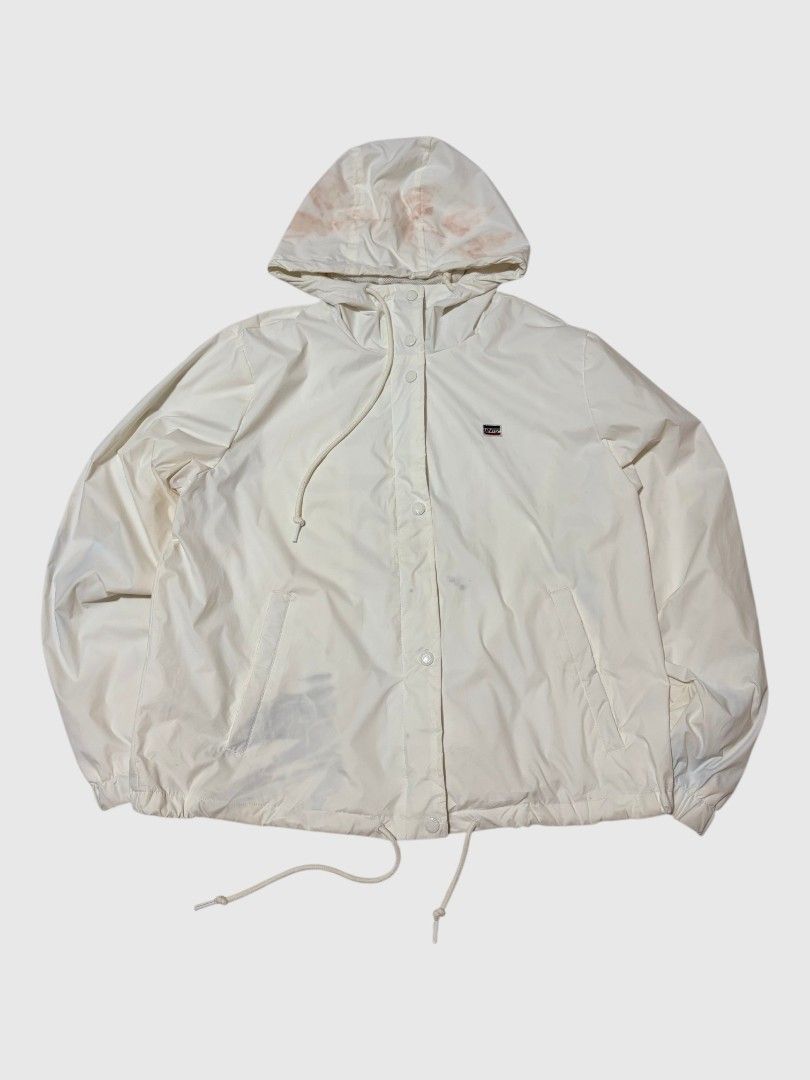 Levi's White Hooded Windbreaker Jacket (Category: Coats, Jackets and Outerwear) located in San Jose. Submitted by rnb_thrift (Listing ID 1459828998, Image 1). Description: - White Levi's windbreaker jacket - Features a hood with drawstring - Adjustable drawstring waist - Snap button and zipper closure - Small Levi's logo on chest - Material: 100% Nylon shell, 100% Polyester lining -22/23.5.
