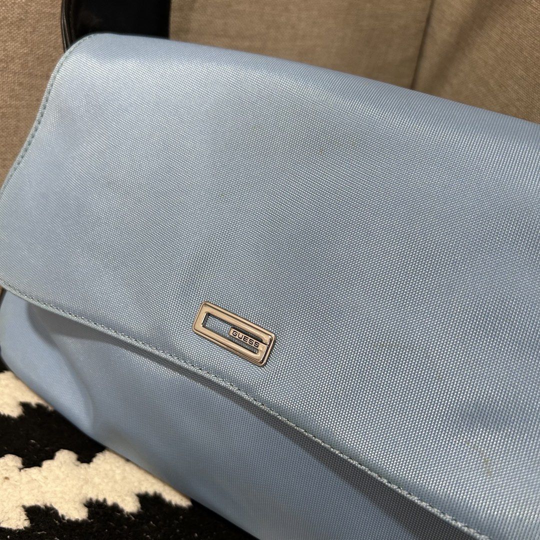 Light Blue Guess Shoulder Bag with Black Straps (Category: Shoulder Bags) located in Manila. Submitted by rsttpld (Listing ID 1459723446, Image 2). Description: - Cute light blue Guess shoulder bag - Black faux leather strap and trim - Simple flap closure with silver Guess logo plate - Ideal for everyday use - Spacious enough for your essentials - Need cleaning .