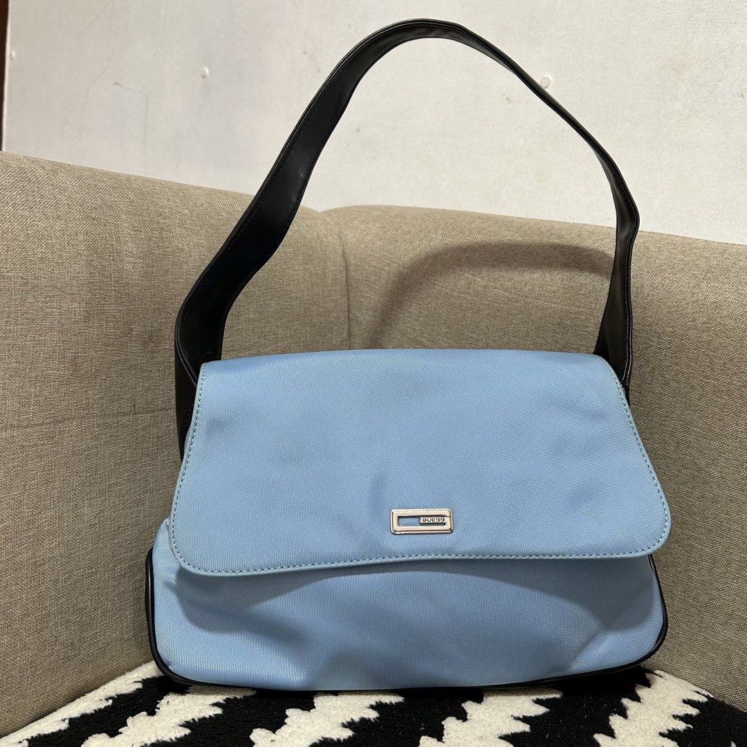 Light Blue Guess Shoulder Bag with Black Straps (Category: Shoulder Bags) located in Manila. Submitted by rsttpld (Listing ID 1459723446, Image 1). Description: - Cute light blue Guess shoulder bag - Black faux leather strap and trim - Simple flap closure with silver Guess logo plate - Ideal for everyday use - Spacious enough for your essentials - Need cleaning .