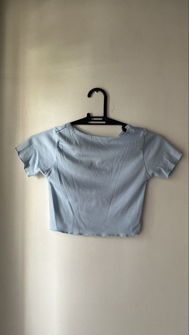 Light Blue Ribbed V-Neck Crop Top (Category: Others Tops) located in Quezon City. Submitted by deargenna (Listing ID 1459826759, Image 2). Description: - Light blue ribbed fabric - V-neck with a small cutout detail - Short sleeves with lettuce hem - Lettuce hem at the bottom - Simple, cute, and versatile design - Effortless to pair with any outfit * 💳 MOP: GCash / Bank Transfer * 🛵 MOD: Same-day delivery via Lalamove / Grab (Buyer pays SF) * 📍