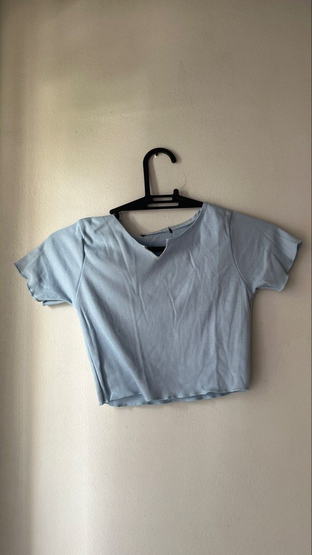 Light Blue Ribbed V-Neck Crop Top (Category: Others Tops) located in Quezon City. Submitted by deargenna (Listing ID 1459826759, Image 1). Description: - Light blue ribbed fabric - V-neck with a small cutout detail - Short sleeves with lettuce hem - Lettuce hem at the bottom - Simple, cute, and versatile design - Effortless to pair with any outfit * 💳 MOP: GCash / Bank Transfer * 🛵 MOD: Same-day delivery via Lalamove / Grab (Buyer pays SF) * 📍