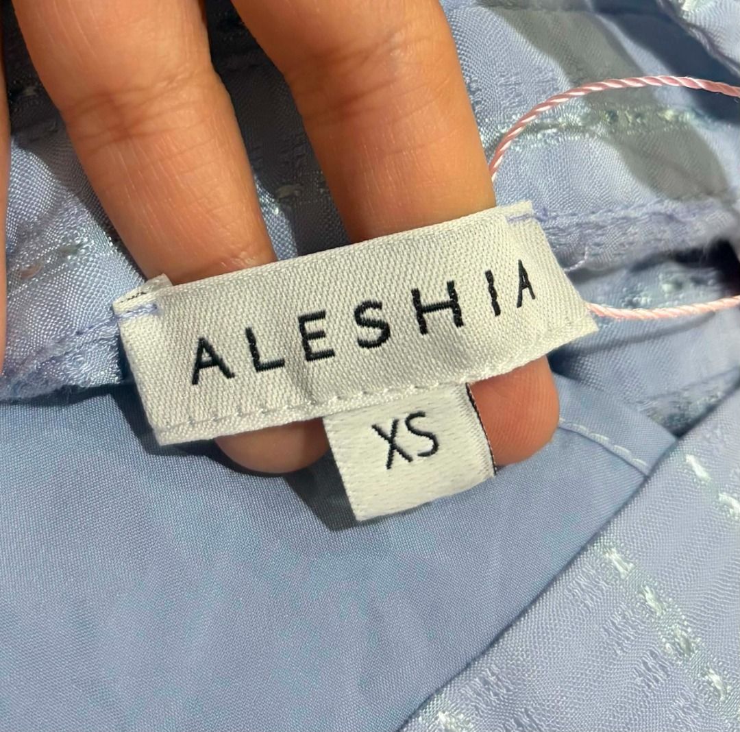 Light Blue Striped Collared Button-Up Mini Dress (Category: Dresses) located in Baguio. Submitted by ellamell (Listing ID 1459745579, Image 2). Description: 44cm bust 35cm waist 88cm height/length - Has an inner - Cute light blue mini dress - Collared neckline with button-up front - Short sleeves - Fabric: Subtle striped texture with a hint of shimmer - Flared skirt with pleats - Versatile: Great for casual outings or office wear.