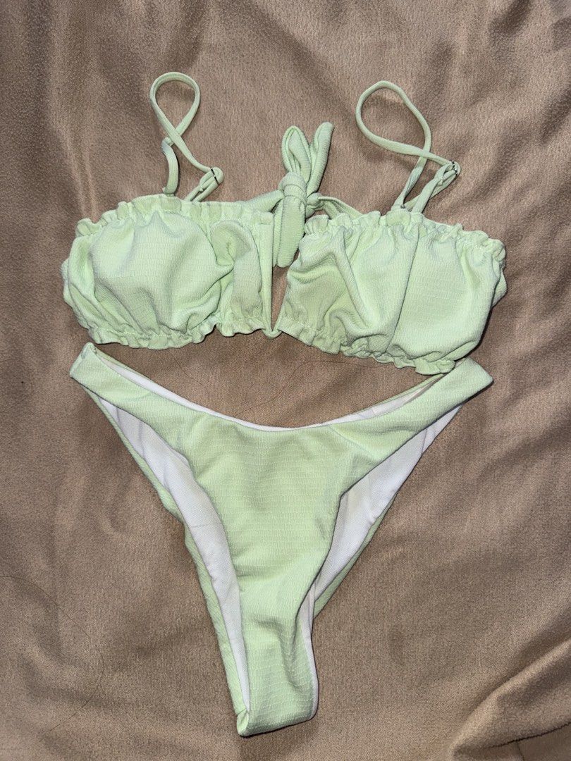 Light Green Textured Bikini Set (Category: Bikinis & Swimsuits) located in Taguig. Submitted by cosmic.jengck320 (Listing ID 1459800196, Image 1). Description: - Cute light green bikini - Textured fabric - Top: Adjustable straps, tie front - Bottoms: Classic cut - Size: Fits XS-S.