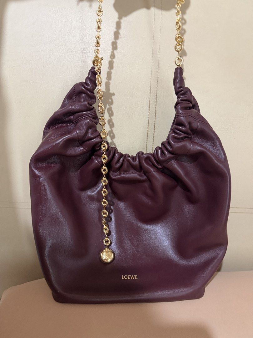 LOEWE - Medium Squeeze Bag (Category: Luxury Bags & Wallets) located in Manila. Submitted by ellejin (Listing ID 1459743312, Image 2). Description: - Dark burgundy - Mellow Nappa leather - No more box. Dust bag only - Used but still in mint condition.