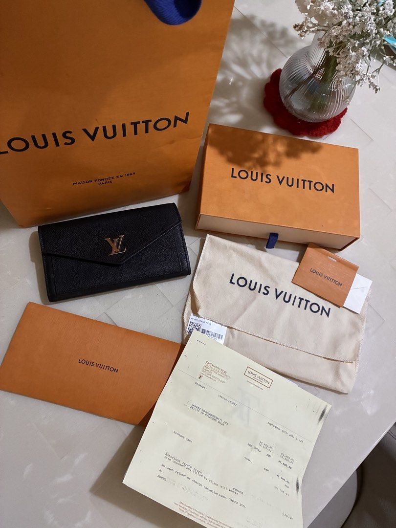 Louis Vuitton My Lockme Wallet Noir (Category: Luxury Bags & Wallets) located in Angeles City. Submitted by Mica0730 (Listing ID 1459713064, Image 1). Description: 🖤 AUTHENTIC LOUIS VUITTON MYLOCKME WALLET — BLACK 🖤 Selling my authentic LV MyLockMe Wallet in Black. Purchased from LV Greenbelt. ✨ 📦 FULL SET: • Original Box • Dust Bag • Paper Bag • Store Receipt ✨ Condition: The exterior is still beautiful and the wallet is structurally sound. H