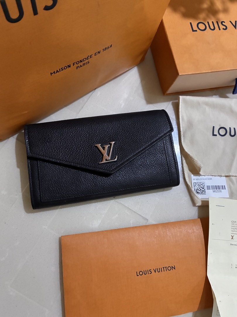 Louis Vuitton My Lockme Wallet Noir (Category: Luxury Bags & Wallets) located in Angeles City. Submitted by Mica0730 (Listing ID 1459713064, Image 2). Description: 🖤 AUTHENTIC LOUIS VUITTON MYLOCKME WALLET — BLACK 🖤 Selling my authentic LV MyLockMe Wallet in Black. Purchased from LV Greenbelt. ✨ 📦 FULL SET: • Original Box • Dust Bag • Paper Bag • Store Receipt ✨ Condition: The exterior is still beautiful and the wallet is structurally sound. H