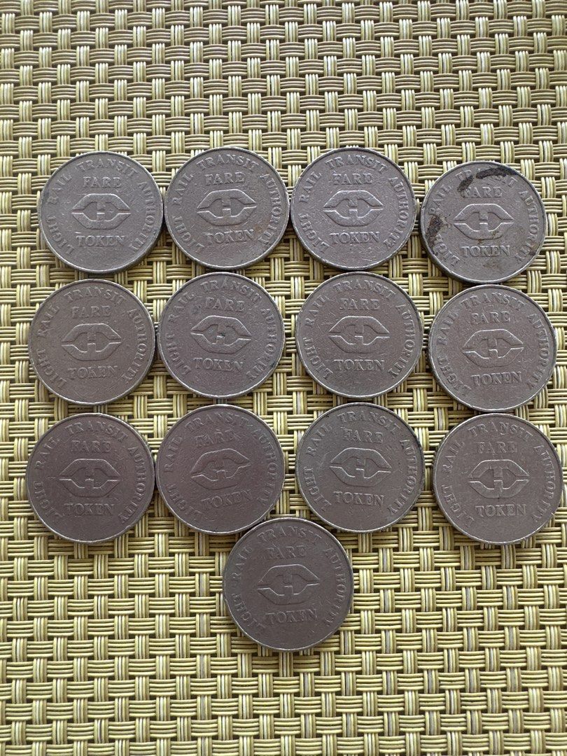 LRT fare token (13pcs) 1980 (Category: Currency) located in Manila. Submitted by ellie.copter (Listing ID 1459733300, Image 1). Description: - Set of 13 Rail Transit Authority fare tokens. - Features the 'H' logo and 'RAIL TRANSIT AUTHORITY FARE TOKEN' inscription - Perfect for collectors or as a unique display item.