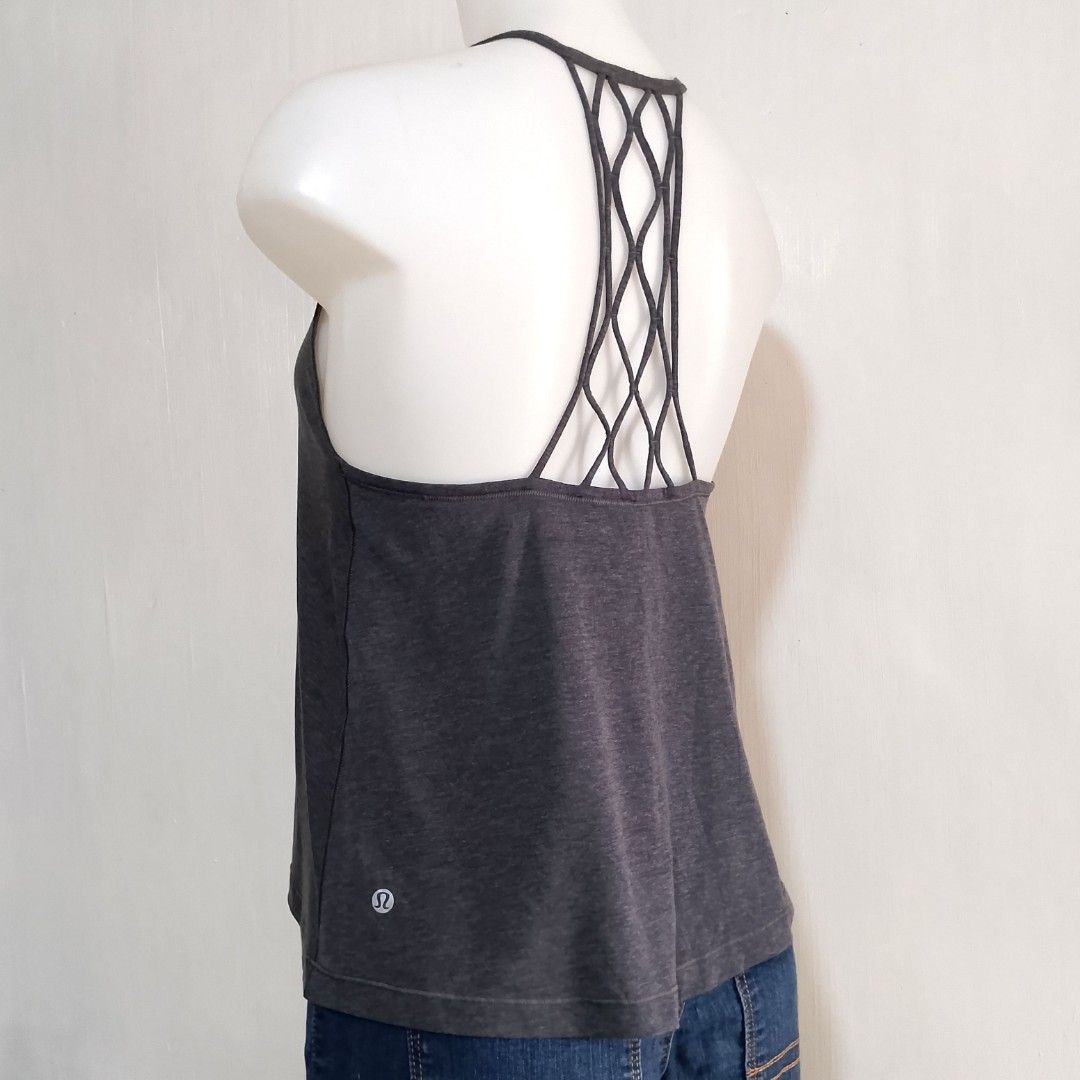 Lululemon Love Knot Tank Top (Category: Activewear) located in Tuguegarao City. Submitted by thriftedtreasures101.1 (Listing ID 1459896157, Image 1). Description: Lululemon Love Knot Tank in the color Heathered Black. This popular style is designed for low-impact yoga or gym practices. It features a loose, flowing fit, a classic scoop neckline and an intricate lattice design at the back. Slightly used, in good condition. Color may vary due to lig