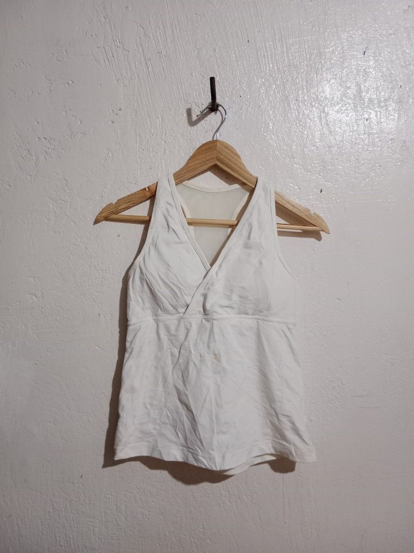 Lululemon White Tank Top with Built-in Bra (Category: Activewear) located in Toledo. Submitted by zealzionta54269 (Listing ID 1459745810, Image 3). Description: - White Lululemon tank top - Built-in bra with mesh back detail - Racerback style - Ideal for workouts and casual wear - Comfortable and breathable fabric -width 14-15 -length 21.