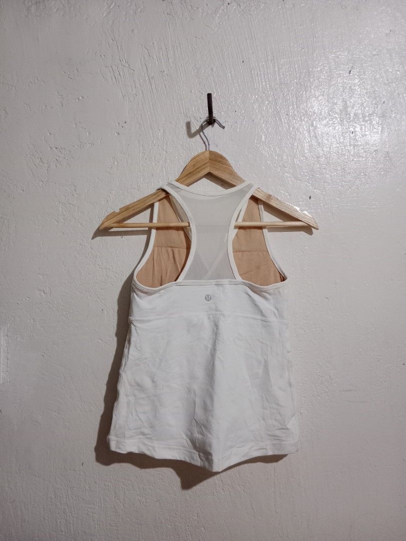 Lululemon White Tank Top with Built-in Bra (Category: Activewear) located in Toledo. Submitted by zealzionta54269 (Listing ID 1459745810, Image 1). Description: - White Lululemon tank top - Built-in bra with mesh back detail - Racerback style - Ideal for workouts and casual wear - Comfortable and breathable fabric -width 14-15 -length 21.
