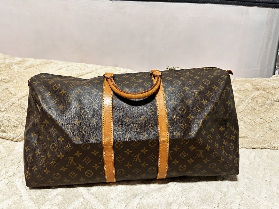 LV Monogram Keepall 55 (Category: Luxury Bags & Wallets) located in Makati City. Submitted by travel.pasabuy (Listing ID 1459784251, Image 2). Description: LV Keepall 55. Monogram canvas, vachetta trim. Great for weekend trips/carry-on. Zipper closure. Handles have patina. Classic travel bag..