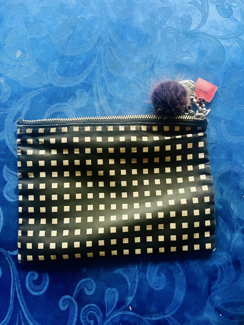 Marc by Marc Jacobs Black White Checkered Pouch (Category: Luxury Bags & Wallets) located in Caloocan City. Submitted by hardestea2026 (Listing ID 1459759062, Image 2). Description: - Cute Marc by Marc Jacobs pouch - Black with white checkered pattern - Small pompom charm attached - Zipper closure - Multiple compartments inside - Ideal for organizing makeup or small essentials.