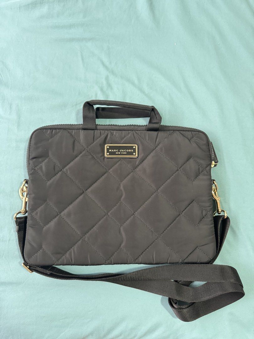 Marc Jacobs Quilted Nylon Laptop Bag (Category: Laptop Bags & Sleeves) located in Makati City. Submitted by bianchiii (Listing ID 1459741392, Image 1). Description: Marc Jacobs Quilted Nylon Laptop Bag in Black and Gold For 13 inches laptop Authentic, bought it from Hong Kong Still in great condition RFS: New laptop is 15 inches, it can’t fit 🥲.