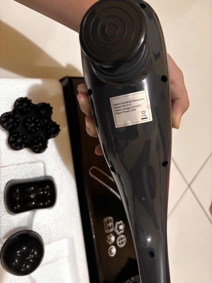 Megawise Handheld Deep Percussion Massager (Model RD-A10) (Category: Massage Devices) located in Manila. Submitted by rmsm. (Listing ID 1459866890, Image 3). Description: - Handheld massager for effective muscle relief - Includes multiple attachments for various massage types - Long handle for easy reach to all body parts - Comes with a convenient storage box - Power cord included.
