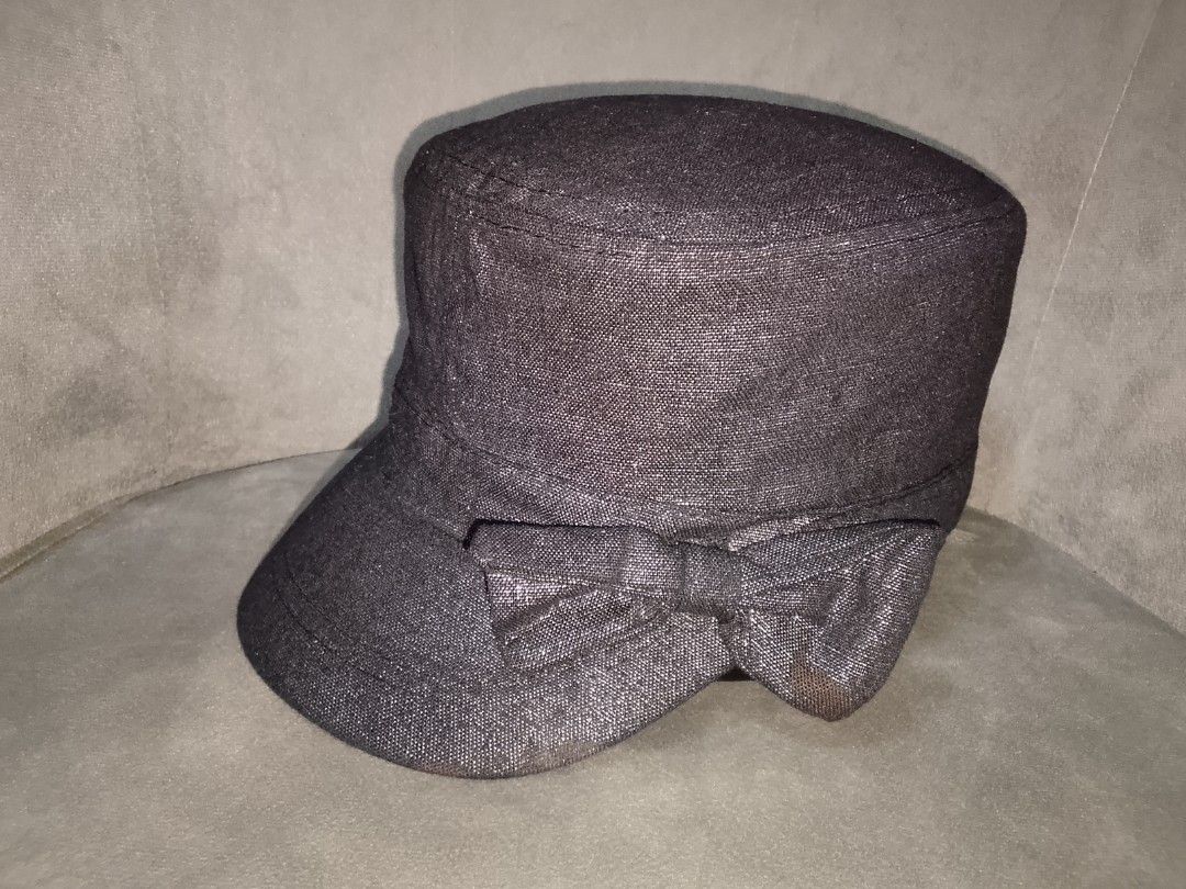 Metallic Black Cadet Style Cap (Category: Hats & Beanies) located in Binangonan. Submitted by yuristalin888 (Listing ID 1459821500, Image 2). Description: This stylish black cadet/military-style cap features a subtle metallic shimmer woven throughout the fabric, a structured flat-top crown, and a curved brim. It is gracefully finished with a matching side bow accent..