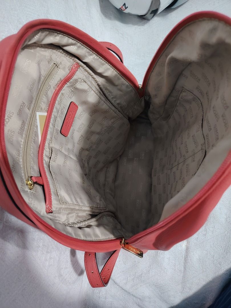 Michael Kors Leather Backpack Coral Pink (Category: Backpacks) located in Manila. Submitted by theshopandsmile (Listing ID 1459847212, Image 1). Description: MICHAEL KORS LEATHER BACKPACK 🎒 ✅ Michael Kors branded ✅ Leather material ✅ Spacious interior with multiple pockets ✅ Front zip pocket ✅ Gold-tone hardware ✅ MK logo lining ✅ With Michael Kors care cards/documents as shown ✅ Preloved — actual condition shown in photos ✅20K in PESO 💯 Brande