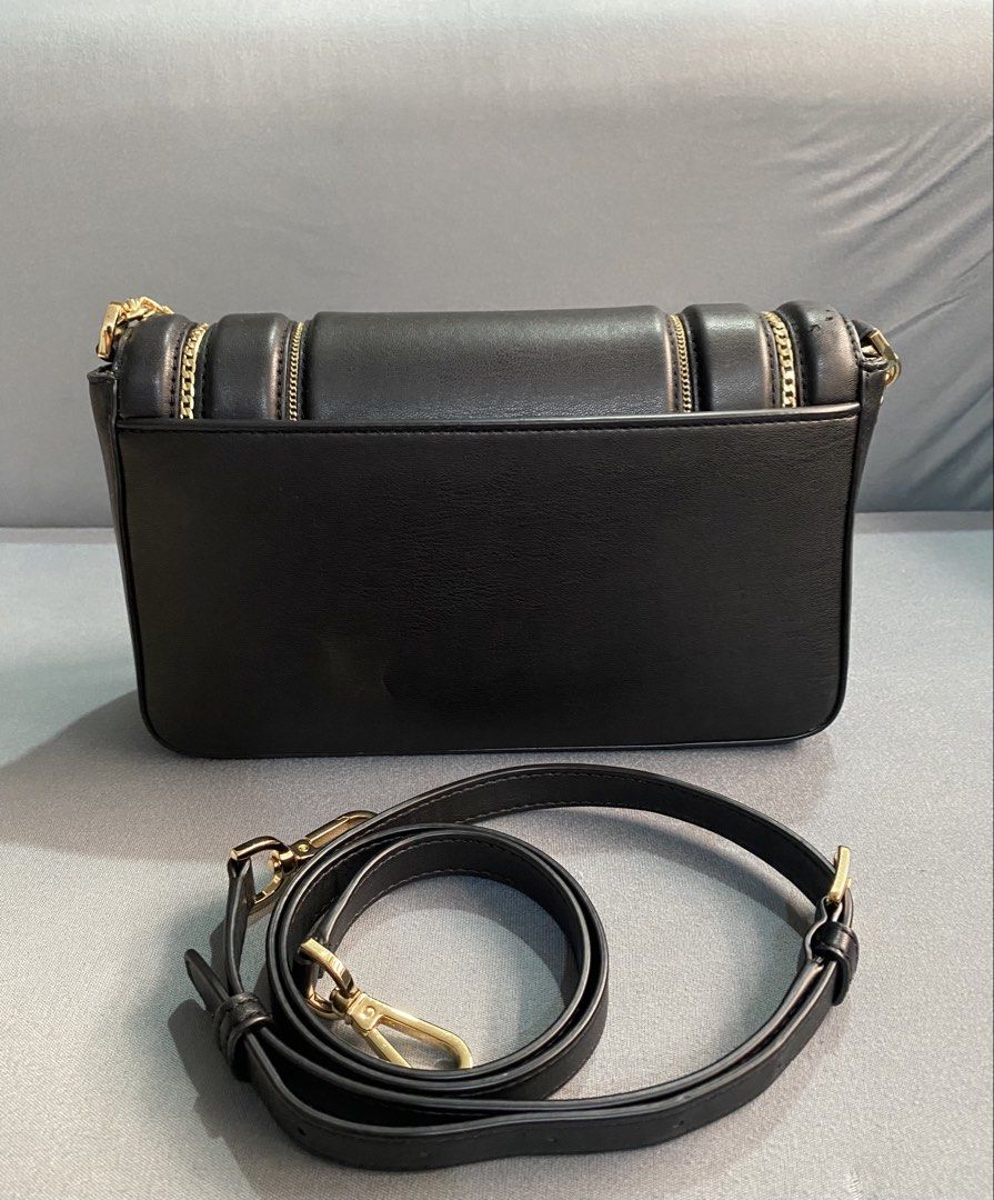 Michael Kors Sonia Medium Leather bag (Category: Luxury Bags & Wallets) located in Trece Martires City. Submitted by miladyoo9 (Listing ID 1459744805, Image 2). Description: Michael Kors Sonia Leather Crossbody bag - Medium size -With gold chain design - can be used as shoulder bag/hand bag or crossbody bag - slightly used (with minimal flaws- see photos).